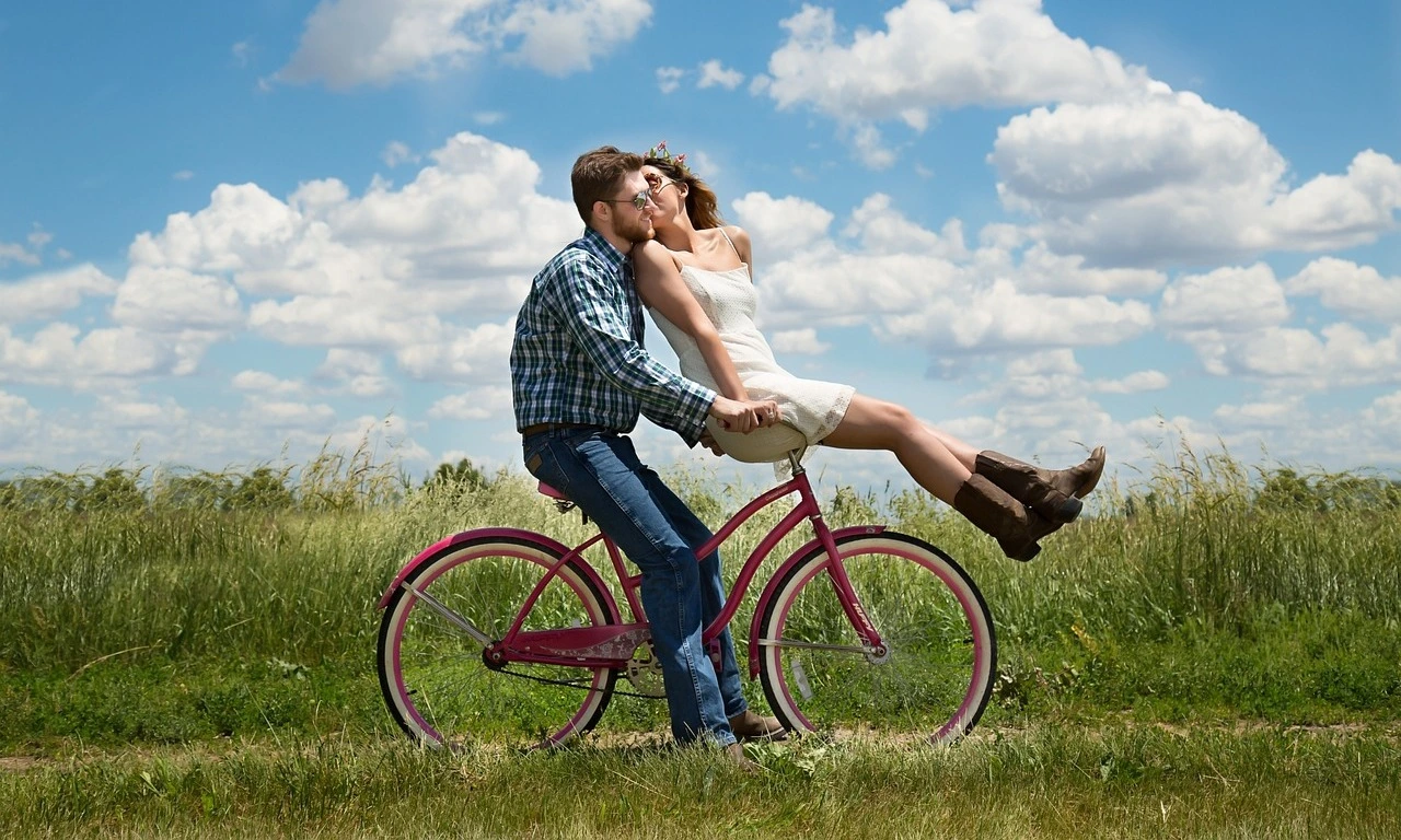 Romantic young couple on the bike